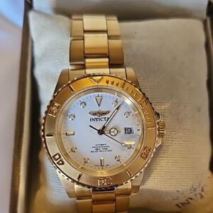 Invicta Gold Timepiece with White Face